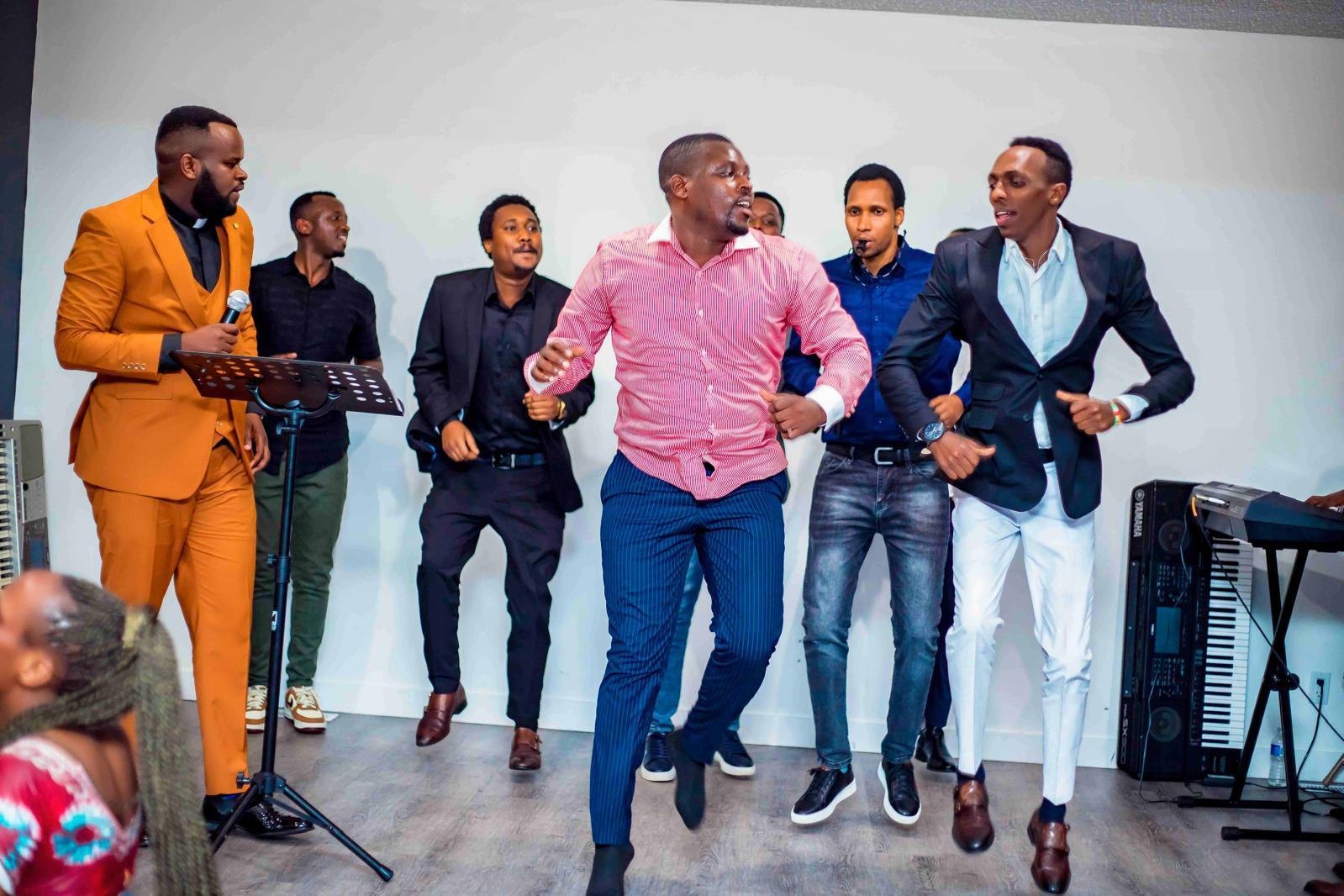 Men dancing at a Hope Ineza Foundation event in Edmonton