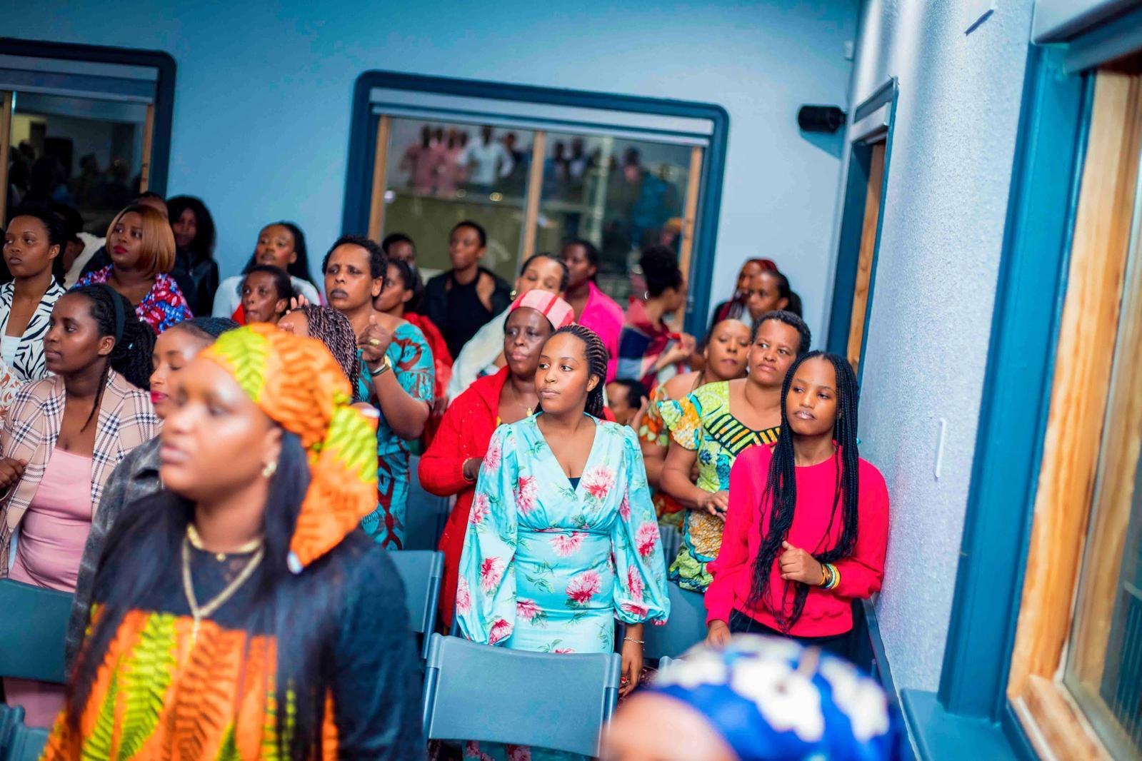 Women seated in the audience at a Hope Ineza Foundation community gathering