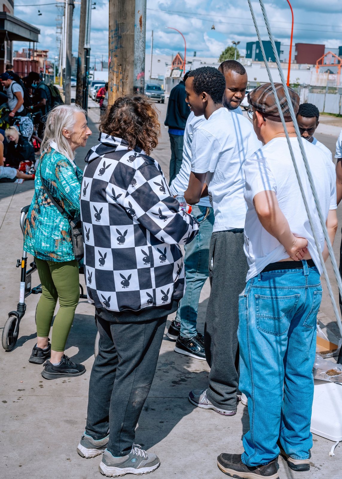 Volunteers standing in conversation with people on the street