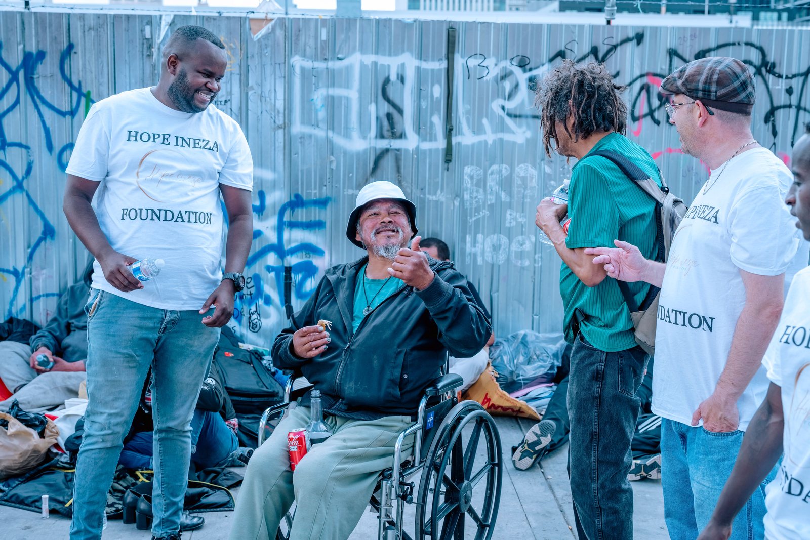 Hope Ineza Foundation volunteers talking with people during a street outreach